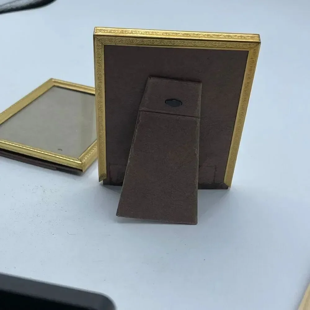 Set of 2 vintage gold colored picture frames 3 X 4”.